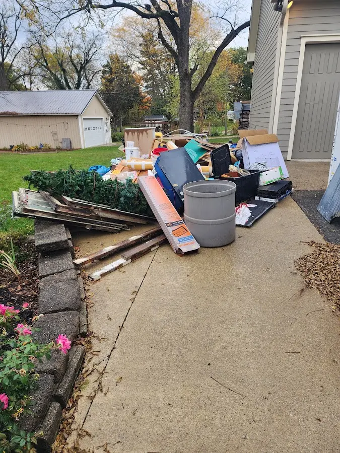 Dumpster being loaded with debris for 3 Yard Dumpster Rental in Pleasant Grove